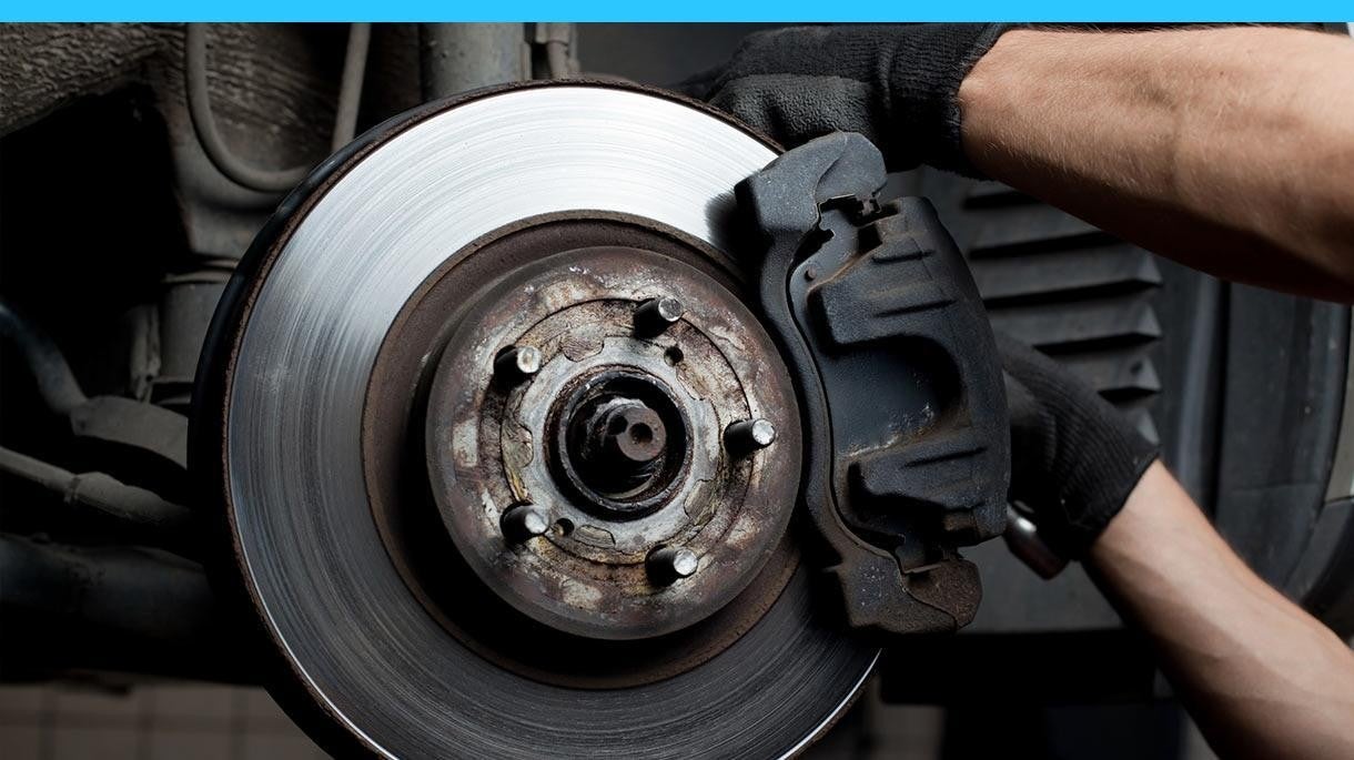 technician changing brakes