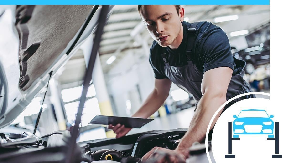 Service technician working on a vehicle
